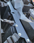 Bracket installed with harness straps and bolts