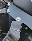 Close-up of bolt and strap on bracket