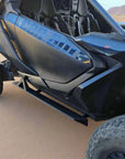 Can-Am Maverick R 2-Seat Rock Slider Steps mounted to a Can-am Maverick R