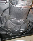 Close-up view of an off-road vehicle's CVT clutch housing and intake system with visible clamps and bolts