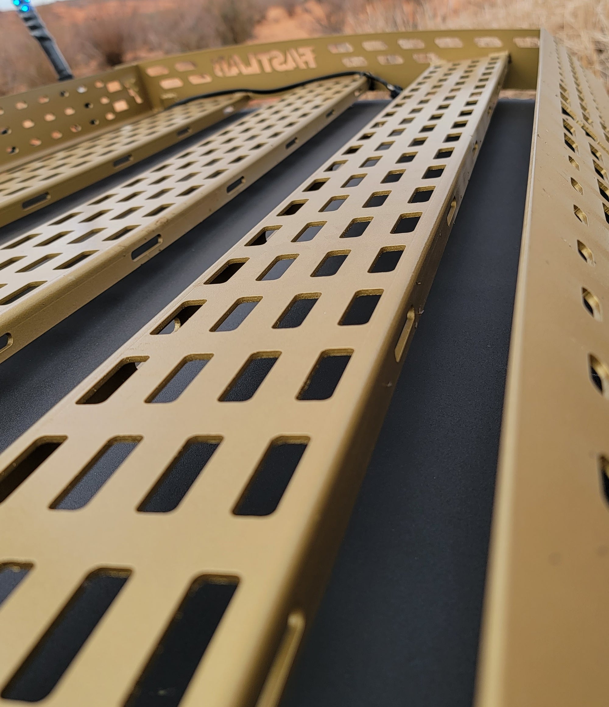 Close-up of FASTLAB UTV laser-cut brackets for Can-Am X3 roof rack