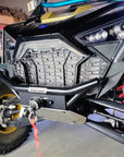 Installed Fastlab winch bumper on a Polaris RZR, with visible red tow strap and front suspension